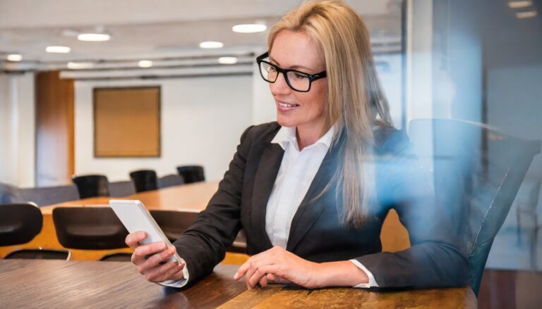 Effective meeting room platform; woman booking meeting room from phone