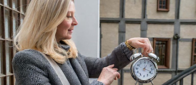 Woman looking at her clock