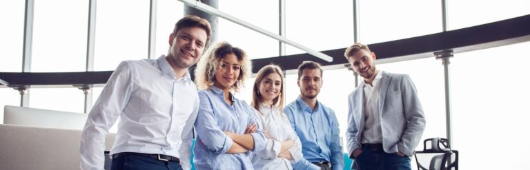 five smilling employees